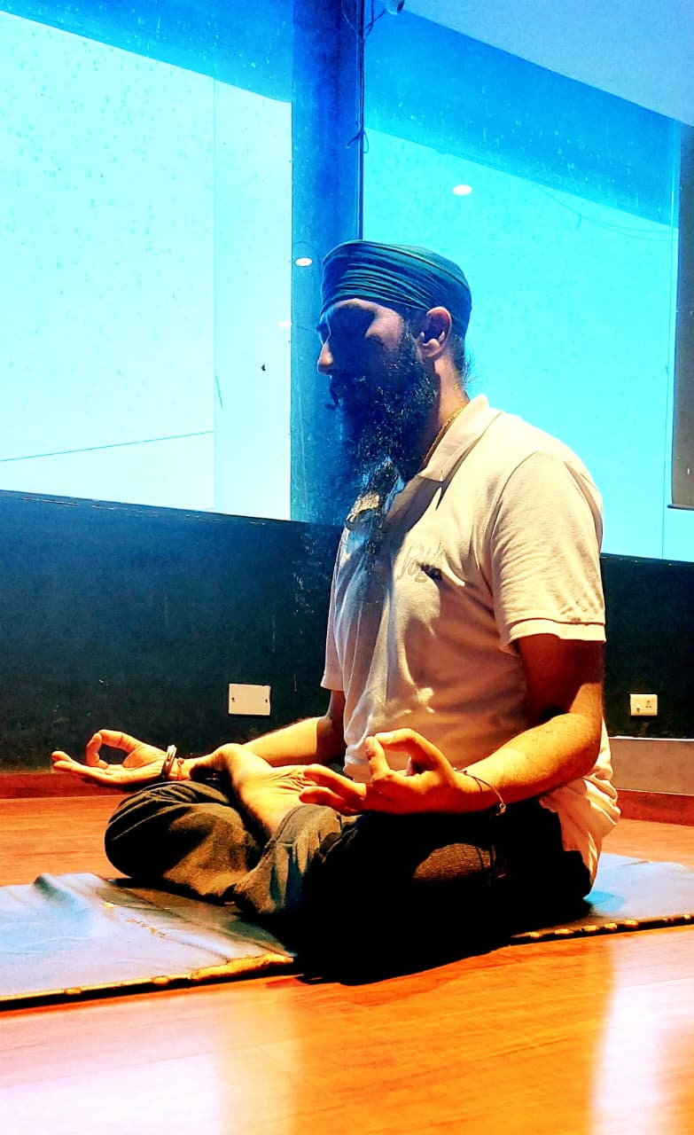 Master Harcharanjeet Singh in seated meditation, side profile